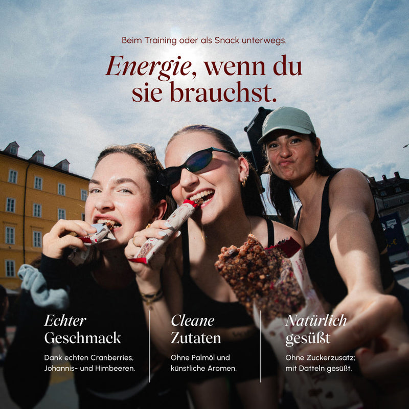Drei Frauen essen draußen Vetain Oatbar Berry; Text „Energie, wenn du sie brauchst" mit drei Vorteilen: echter Geschmack, cleane Zutaten, natürlich gesüßt.
