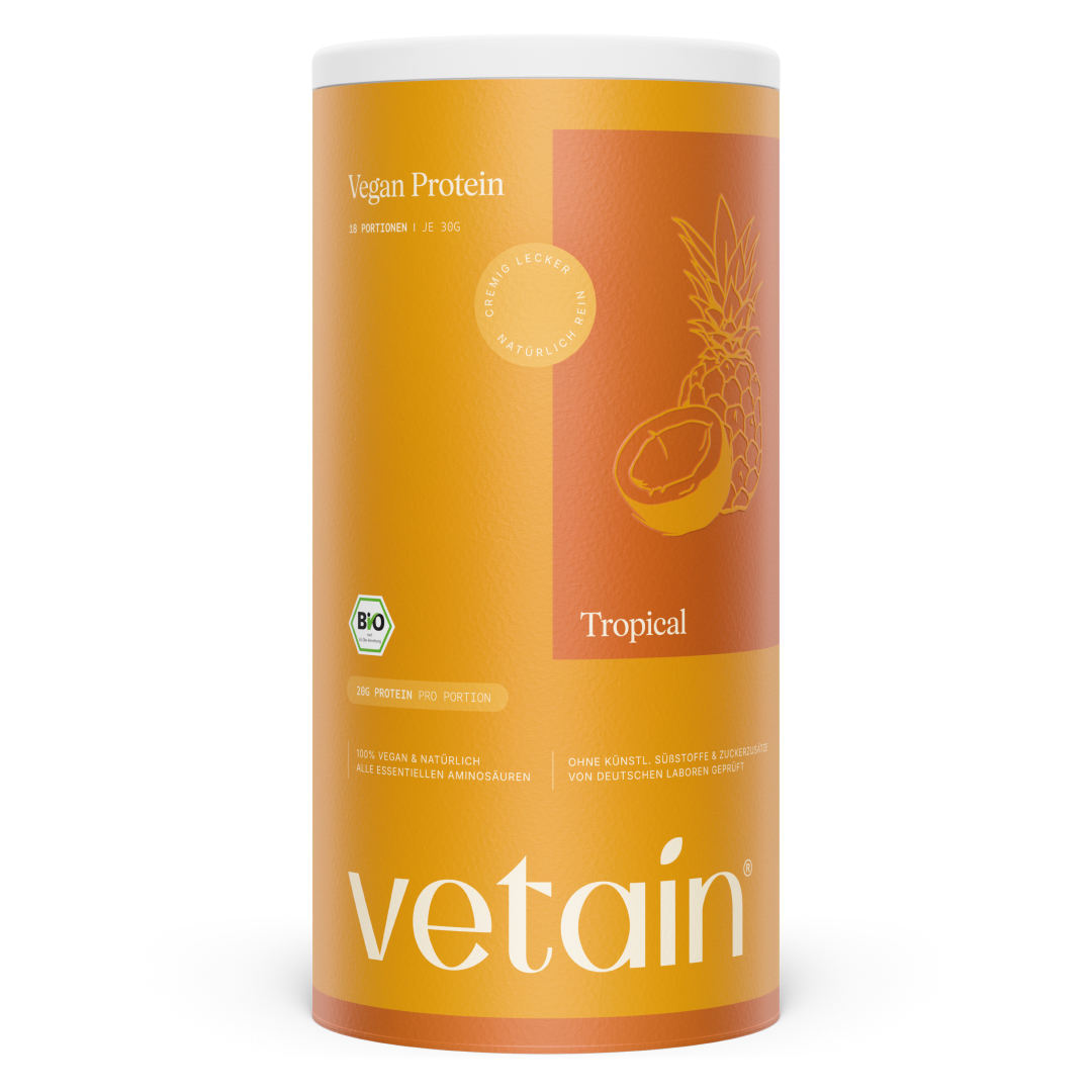 Vetain Vegan Protein Tropical in orange packaging with pineapple and coconut illustration, front view and isolated on white background; organic seal, 20 g protein per serving.